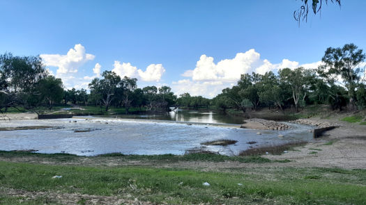 weir and rapids in river