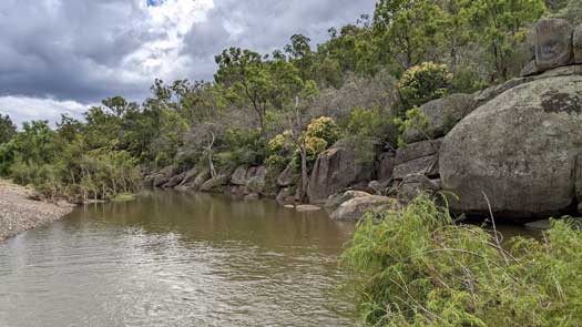 Boulders beside a river