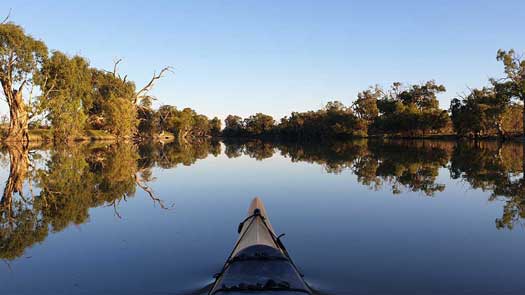 Reflections on a still river