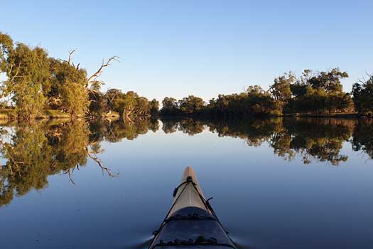 Reflections on a still river