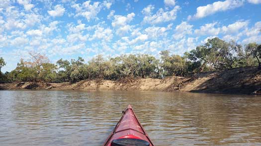 fluffy clouds over river