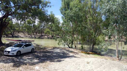 Car parked beside creek