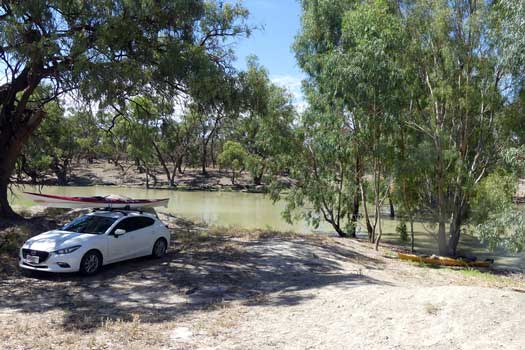 Car parked beside creek