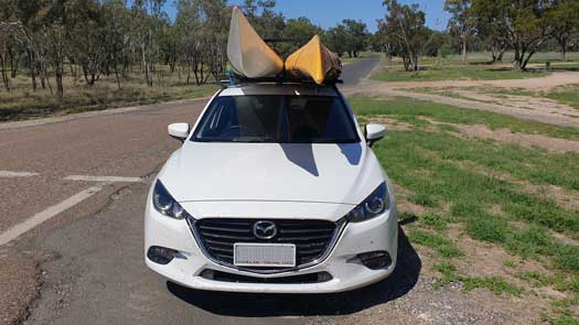 two kayaks on roof of car