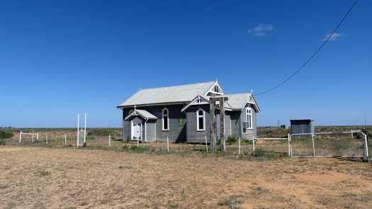 Old building standing in a field