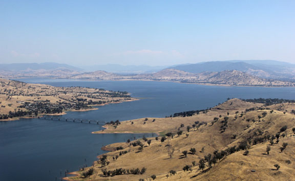 Lake surrounded by sun-baked hills