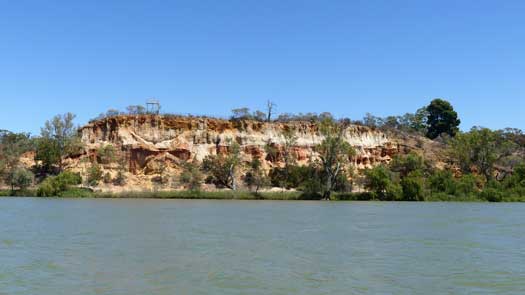 Colourful cliff by river