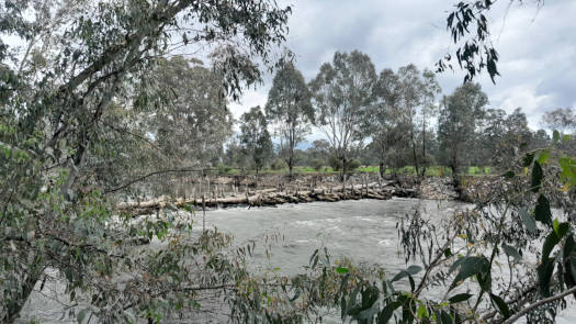 River flowing through old log structure