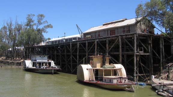 Paddle boats beside a wharf