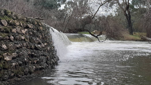 Flowing river over weir