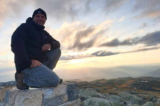 Man on stone cairn