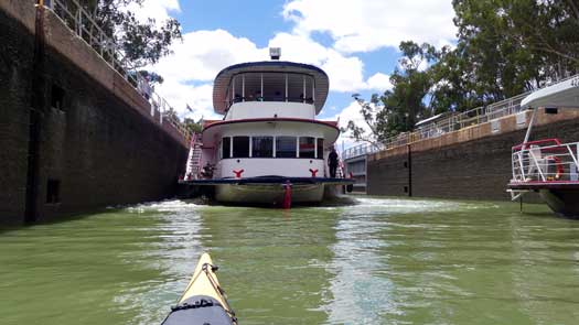 Two large boats and kayak in lock