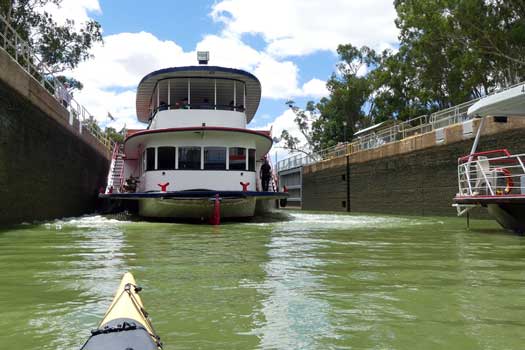 Two large boats and kayak in lock