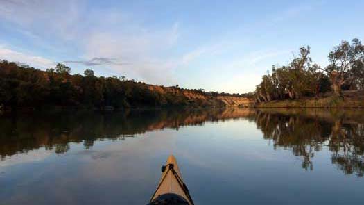 Kayak on mirror glass water