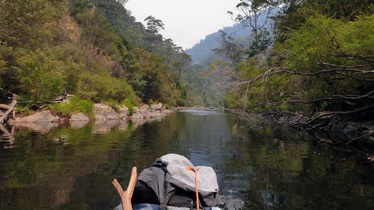 Calm river surrounded by cliffs