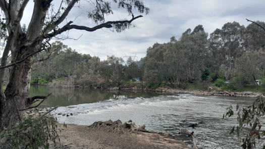 Flowing river over weir