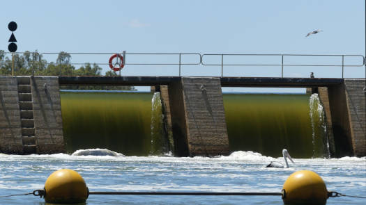 Water flowing through weir