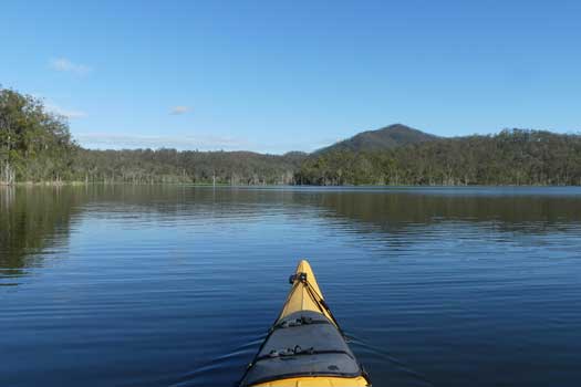 Lake under clear blue skies